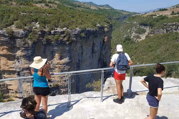 Tourists enjoying the stunning views of Albania's canyons during a scenic lookout on the 6-day Albanian Highlights tour.