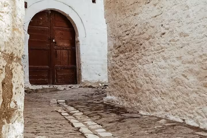 Explore the charming cobblestone streets and historic archways of Albania on a guided four-day tour.