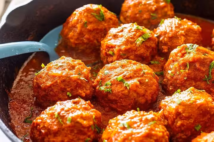 Delicious albondigas in rich tomato sauce served on the Gràcia Catalan food tour in Barcelona.