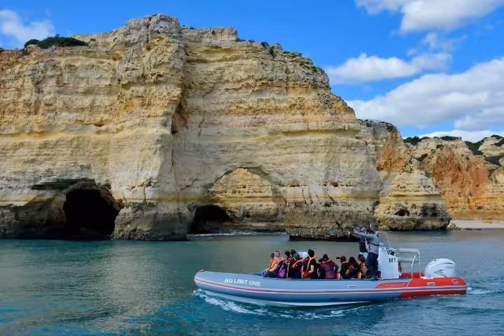 Private boat charter from Albufeira cruising past Algarve sea caves and golden cliffs on a customizable tour
