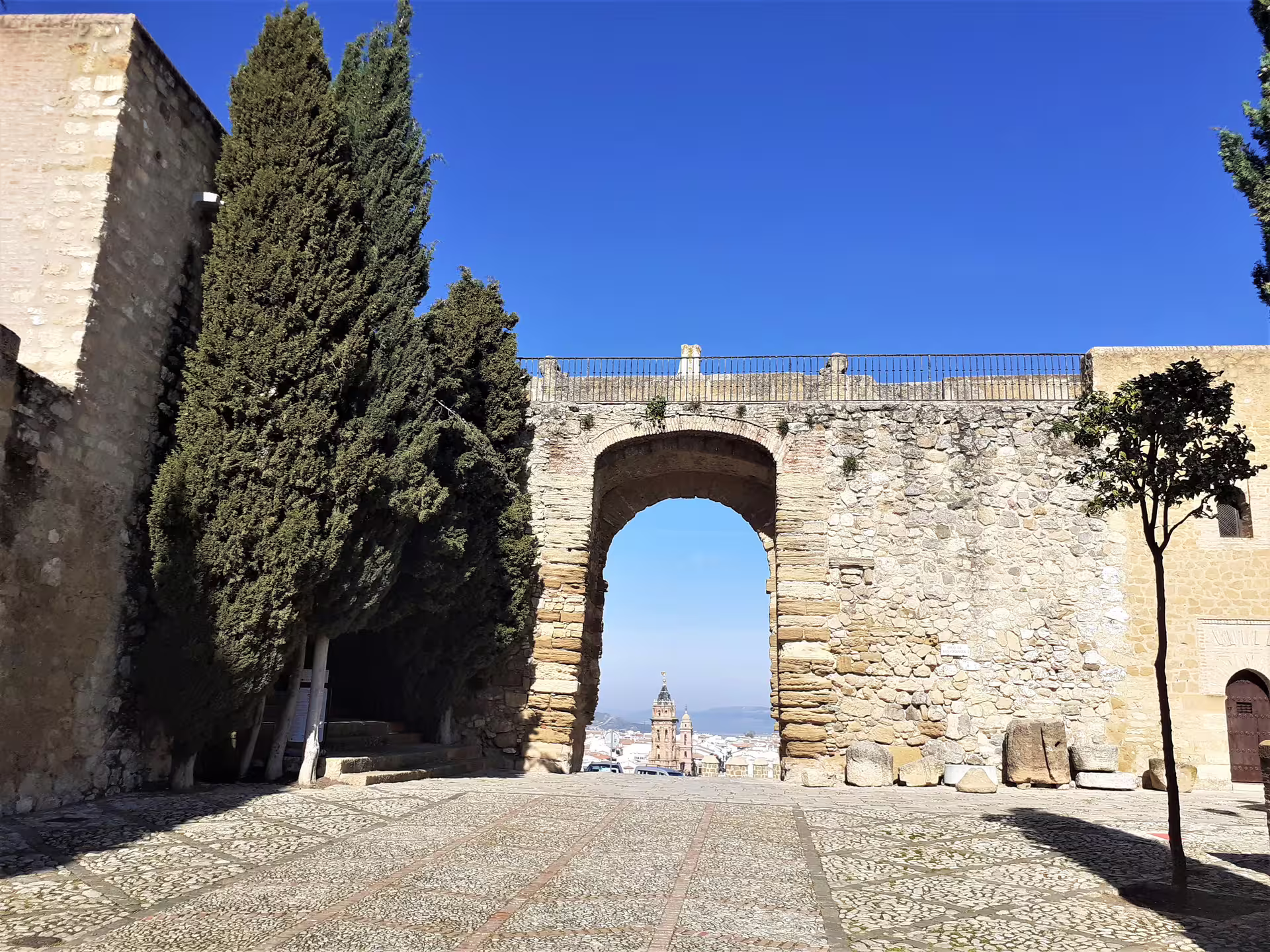 Stone arch at Alcazaba of Antequera overlooking town, cultural stop on private Antequera and El Torcal tour