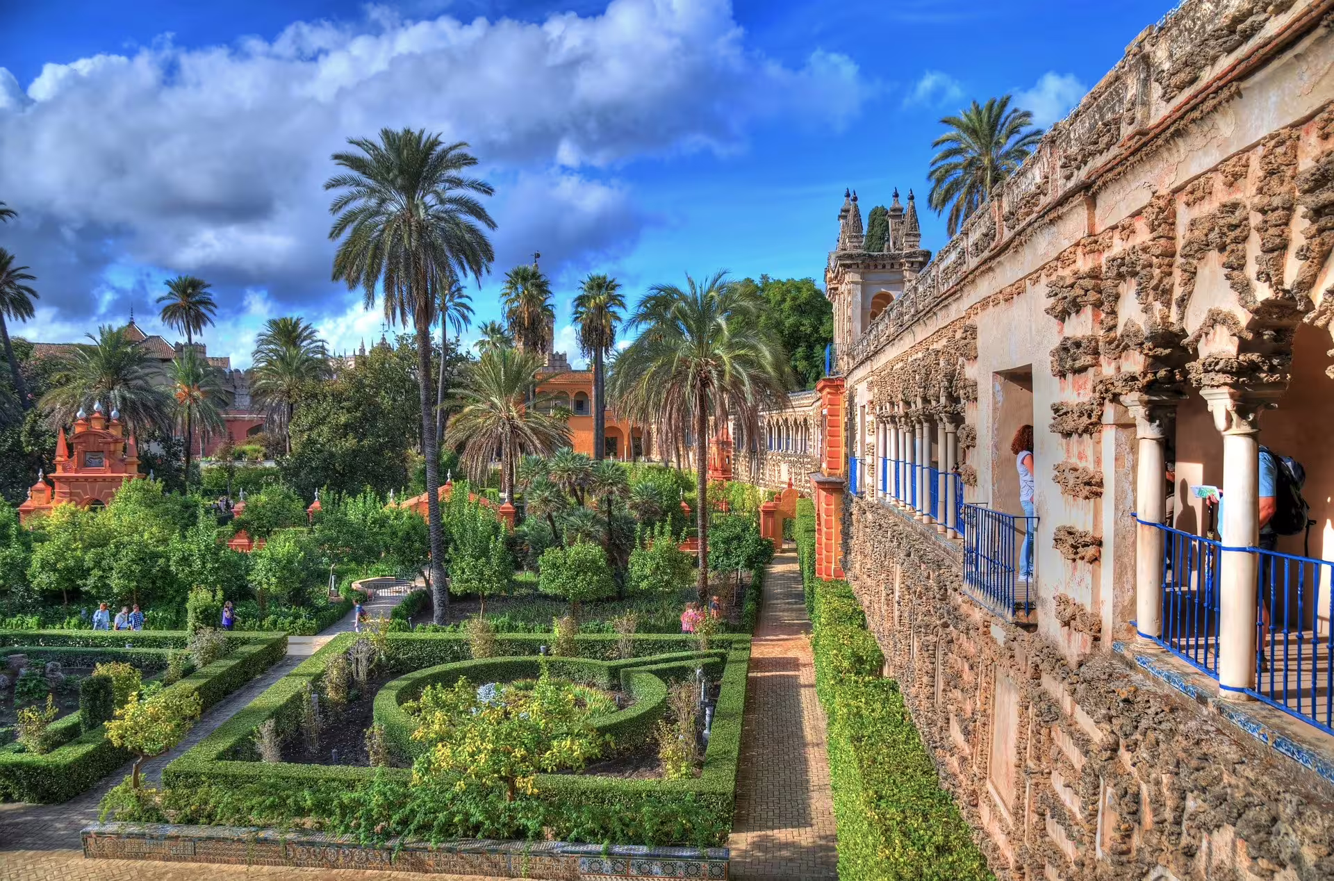 Alcázar of Seville gardens and palace walkway on a private day trip from Costa del Sol with guide