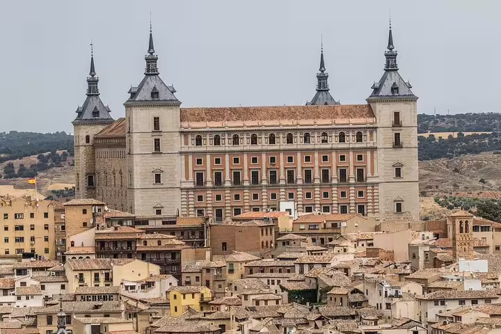 Alcázar of Toledo towering above the old town rooftops, highlight of a private day trip from Madrid to Toledo