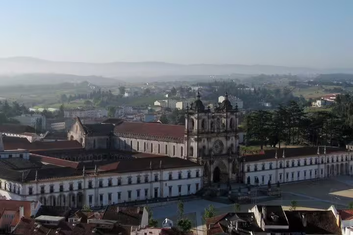 Aerial view of Alcobaça Monastery in Portugal, showcasing its stunning architecture, part of the Obidos, Nazare, and Alcobaca private tour.