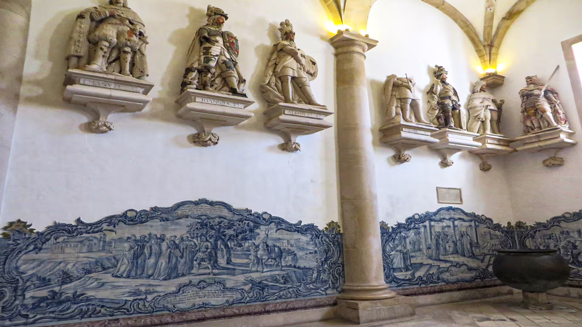 Azulejos and statues adorn the historic interior of Alcobaça Monastery, a highlight of the Nazaré private tour.