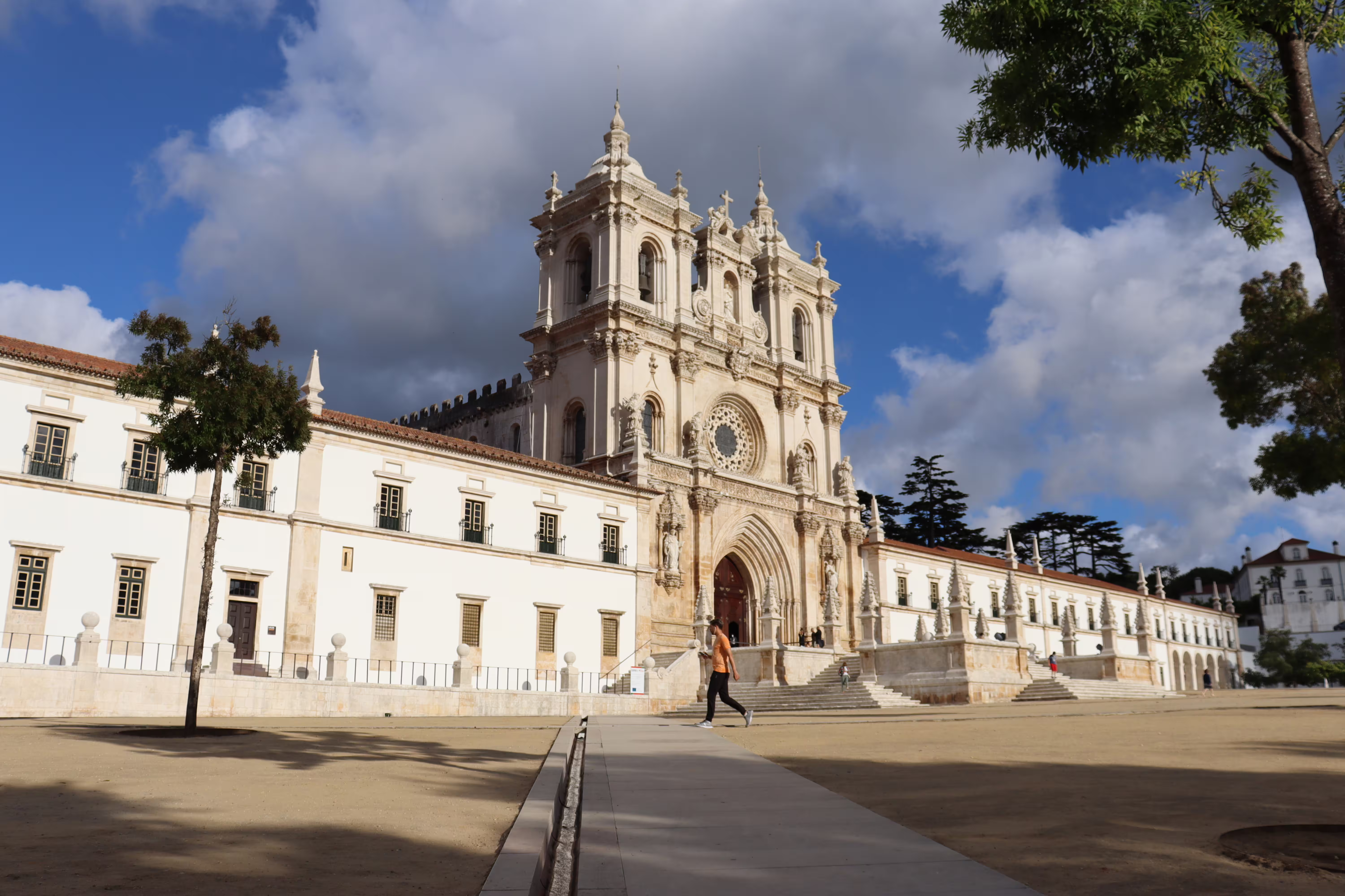 Historic Alcobaça Monastery facade under a blue sky, featured in our private tour of Nazaré and Alcobaça in Portugal.