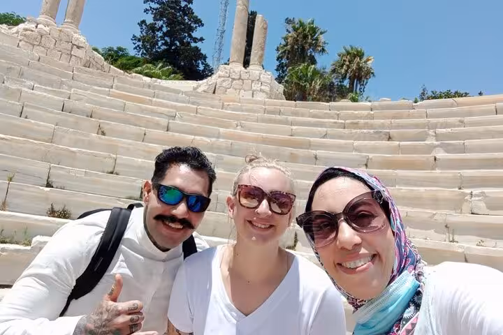 Travelers selfie at Kom El Dikka Roman Theatre on a private Alexandria day tour from Cairo with guide