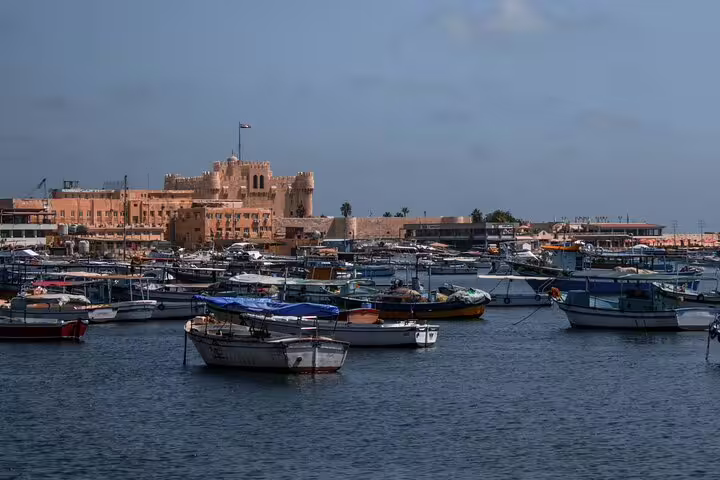 Alexandria harbor boats with Qaitbay Citadel view on a private day tour from Cairo to Alamein