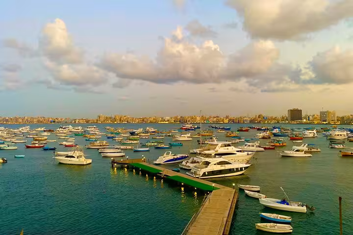 Alexandria marina packed with boats and yachts at golden hour on a private day tour from Cairo, Egypt