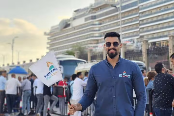 Tour guide at Alexandria Port cruise pickup for Cairo pyramids, Citadel and Khan El Khalili bazaar tour