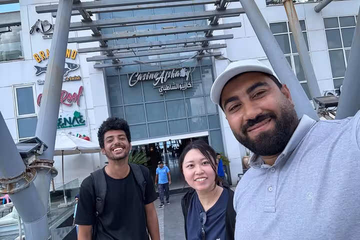 Guests with Alexandria tour guide outside Casino Al Shatby, a stop on VIP private day tour with lunch