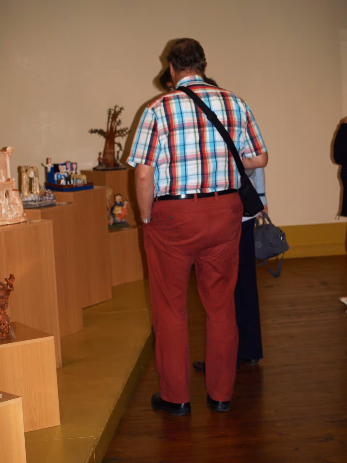 Visitors explore traditional Algarve handicrafts in a local museum, discovering regional culture on a heritage tour
