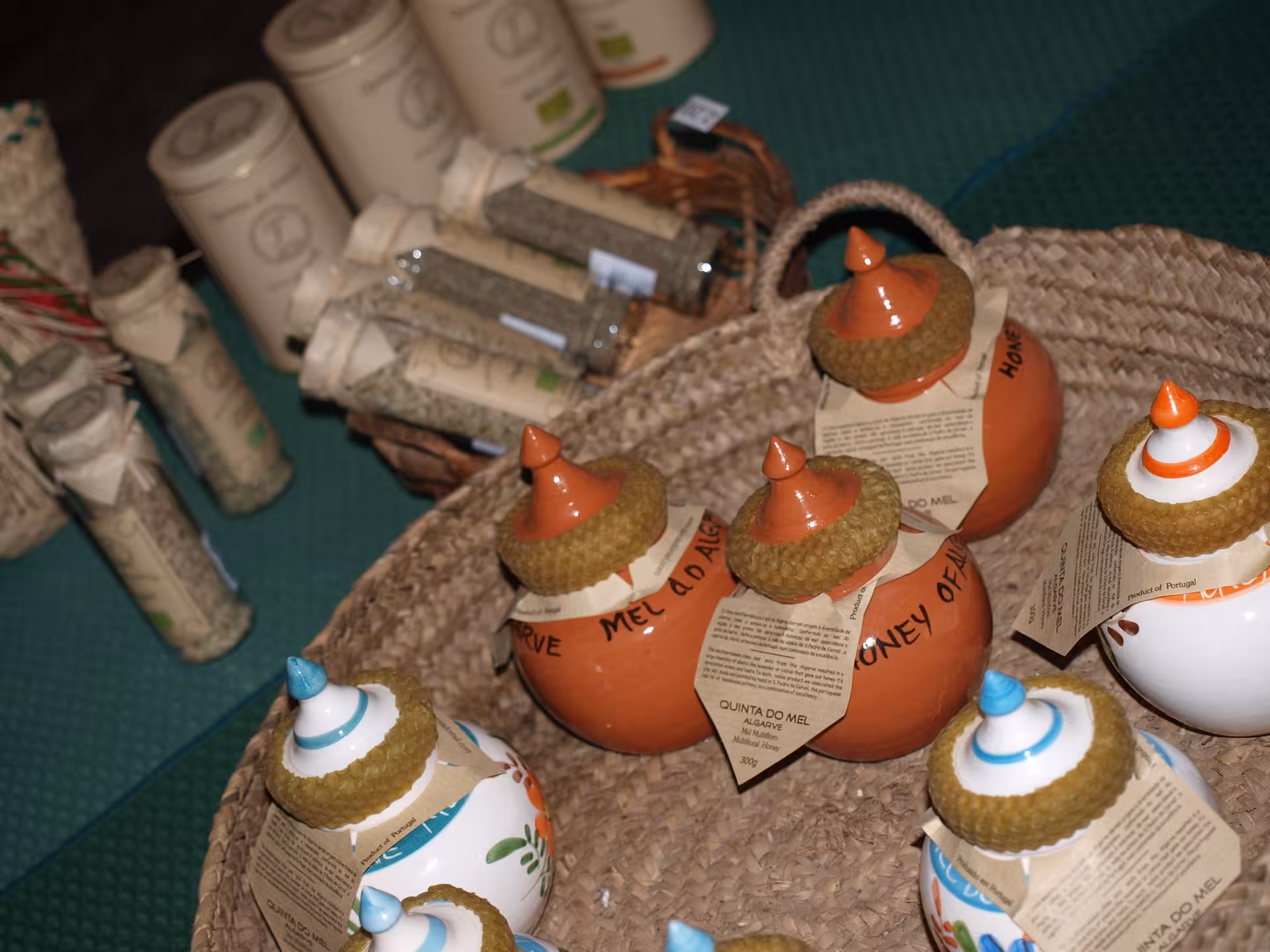 Traditional Algarve honey jars and local herbs displayed in a basket, a typical product stop on a Portugal jeep safari tour