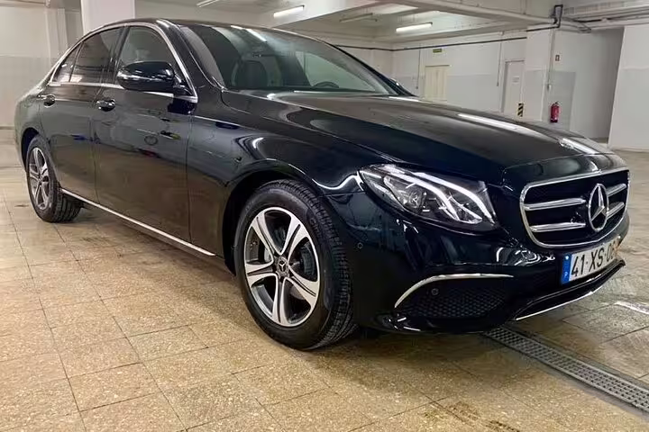 Luxurious black Mercedes sedan for Algarve to Lisbon private journey, offering a comfortable and direct travel experience.