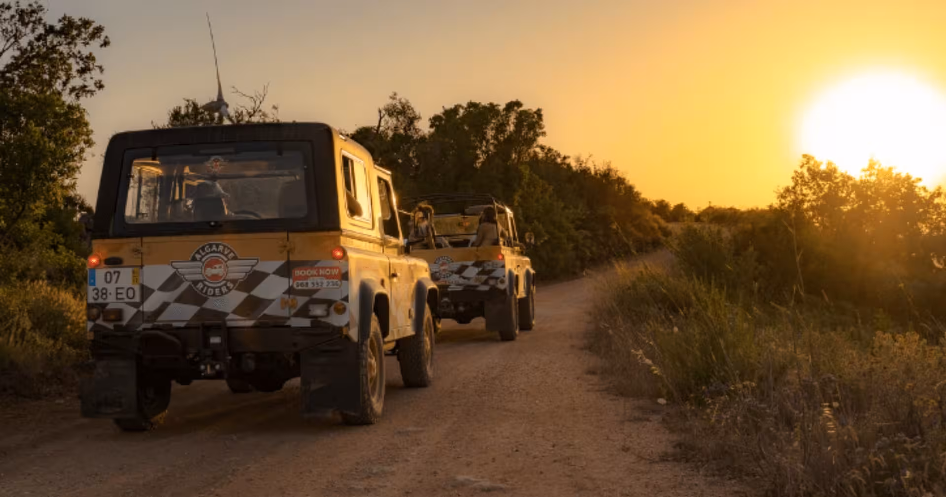 Algarve Riders jeeps driving along a dusty trail through lush greenery during a scenic private sunset safari