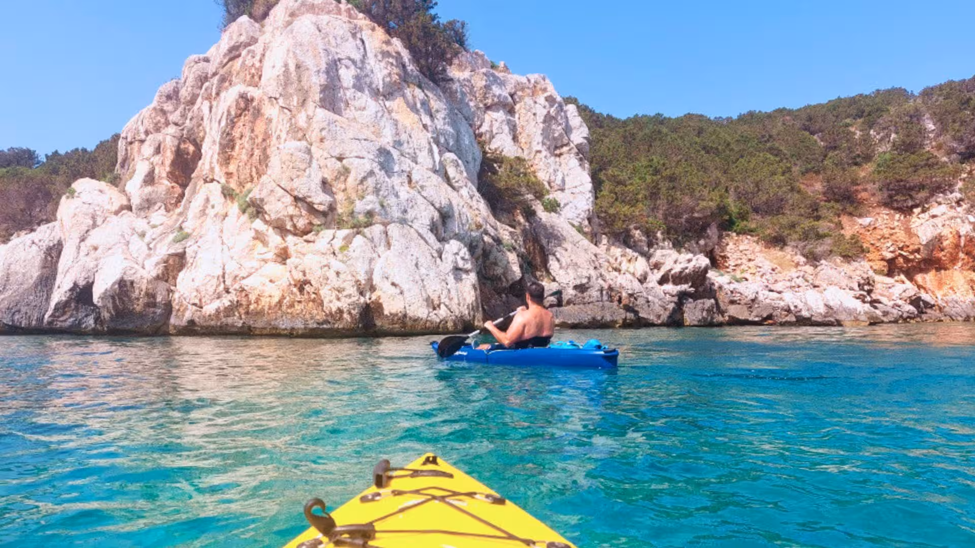 Explore Porto Conte Park's stunning rock formations and crystal waters on a guided kayak tour in Alghero.