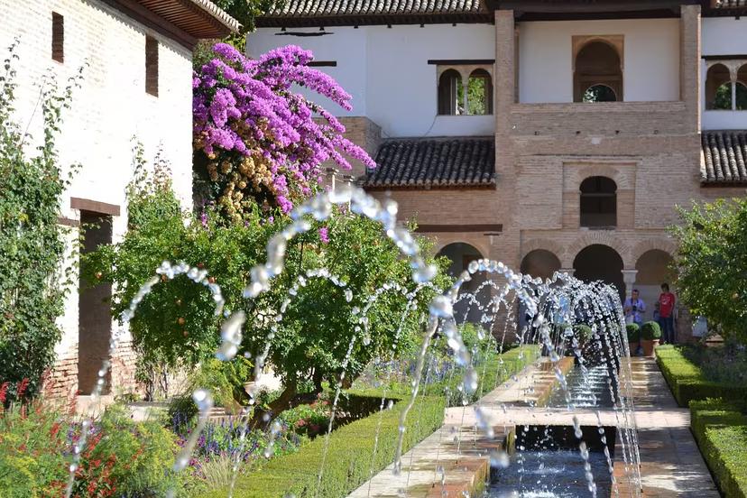 Stunning fountains and vibrant gardens of Generalife at Alhambra, showcasing exquisite Moorish landscape design.