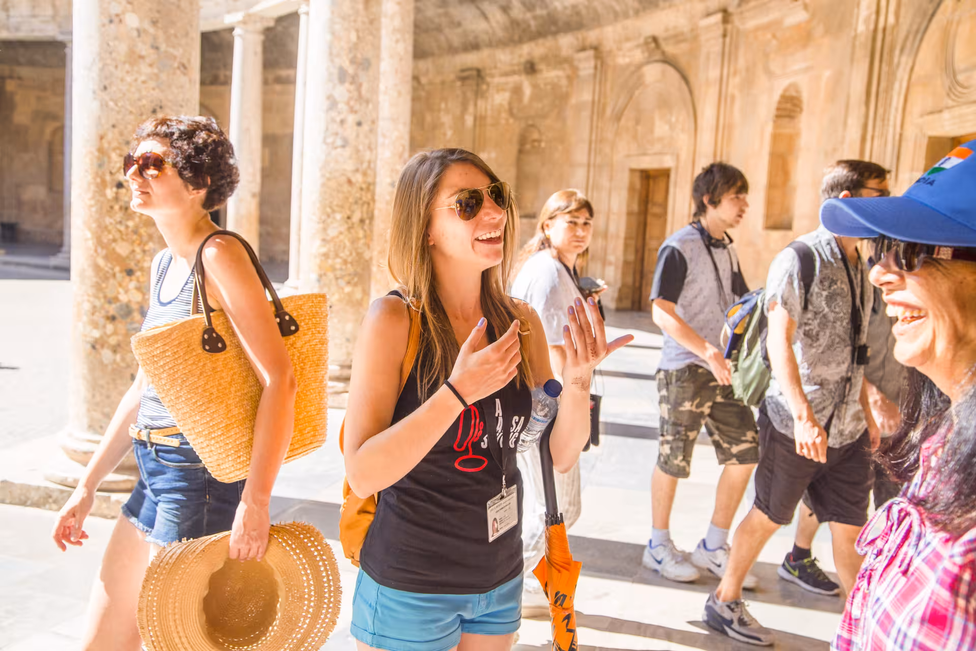 Tourists enjoy a guided tour of the Alhambra's Nasrid Palaces, exploring its rich history and stunning architecture.