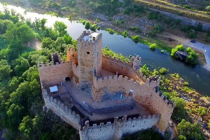 Aerial view of Almourol Castle surrounded by the Tagus River, a highlight of the Tomar and Almourol tour from Lisbon.
