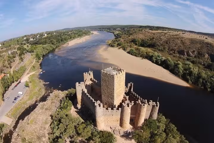 Aerial view of Almourol Castle on a small island in the Tagus River, perfect for Templar exploration tours.