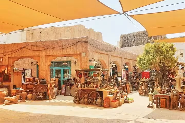 Al Seef spice souk courtyard with traditional stalls and souvenirs on customizable Dubai shopping outlet tour
