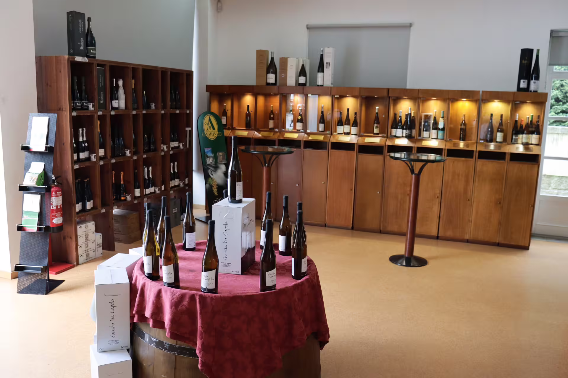 Wine tasting room showcasing Alvarinho bottles in Melgaço and Monção, highlighting Portugal's renowned wine region.