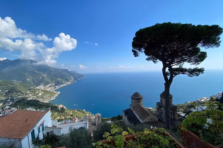 Panoramic vista of the Amalfi Coast's coastline and sea, ideal for exploring on a full-day minivan tour from Sorrento.