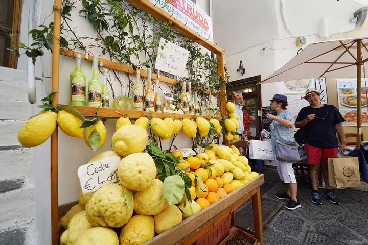 Fresh citrus fruits and local products on display at a market stall in Positano, Amalfi Coast.