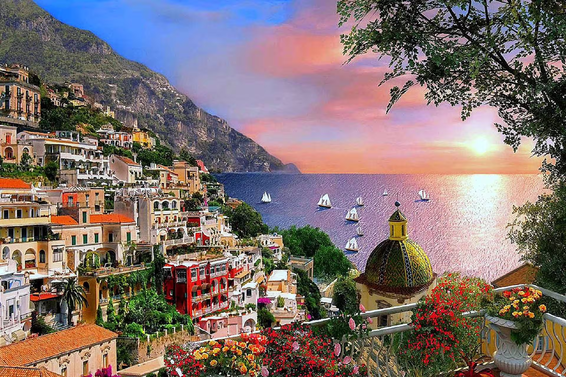 Sunset view over Positano on Amalfi Coast tour from Naples, colorful hillside houses and sailboats