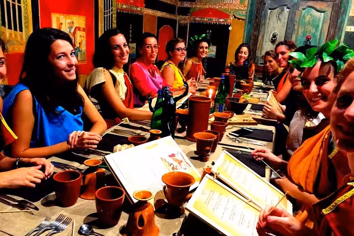 Group enjoying Italian dinner in Sorrento restaurant, part of 6-day private Amalfi Coast tour from Rome
