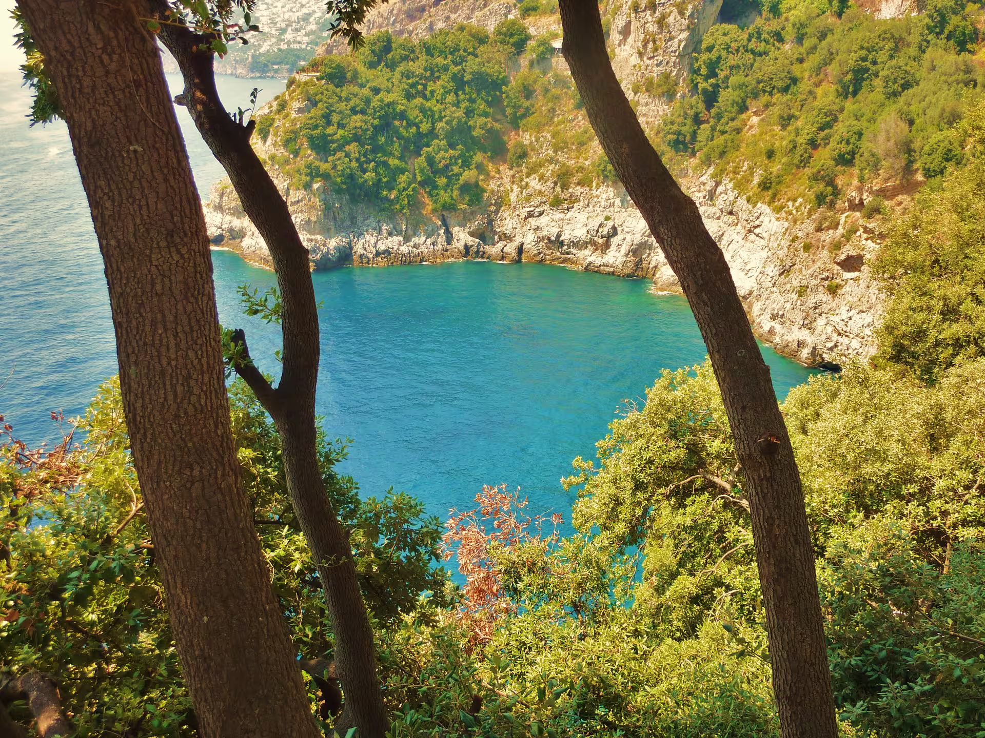 Amalfi Coast turquoise bay and cliffs, scenic stop on Sorrento Positano Amalfi group tour from Naples