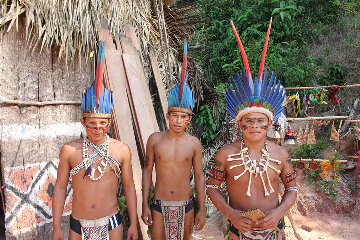 Meet indigenous locals in traditional attire, offering a rich cultural experience on the Amazon Adventure Trip at Tapiri Lodge.