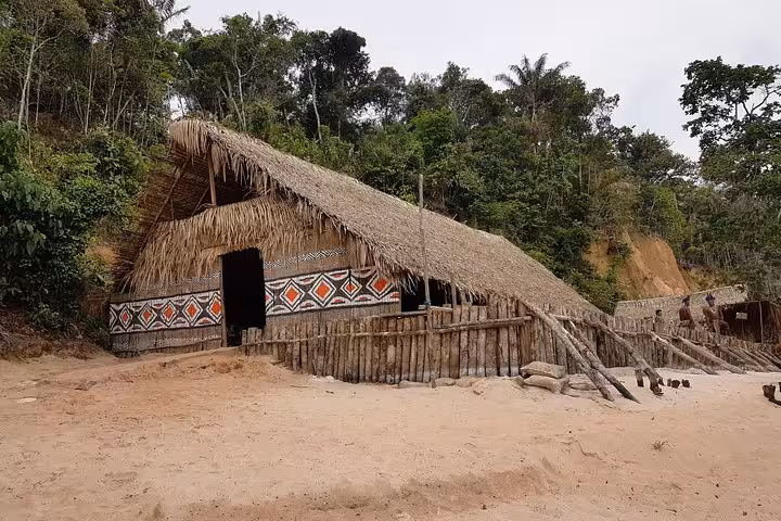 Traditional thatched Amazon jungle lodge with tribal patterns, ideal base on a 5-day Amazon adventure tour