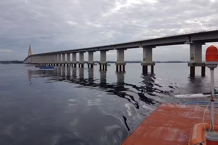View of the Rio Negro bridge from the boat deck near Manaus on a 4-day Amazon River boat tour cruise