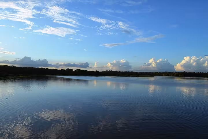Calm Amazon River panorama on the Santa Rosa to Iquitos VIP speedboat journey in Peru Amazonia