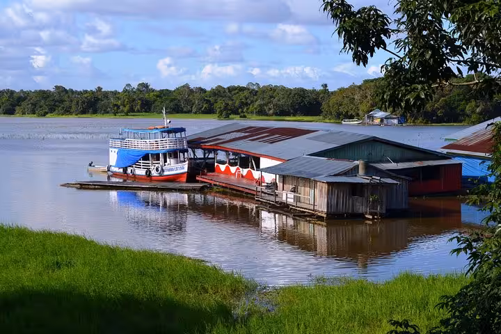 Amazon riverboat docked at riverside community on the Manaus to Santarém boat trip, showcasing local life on the river