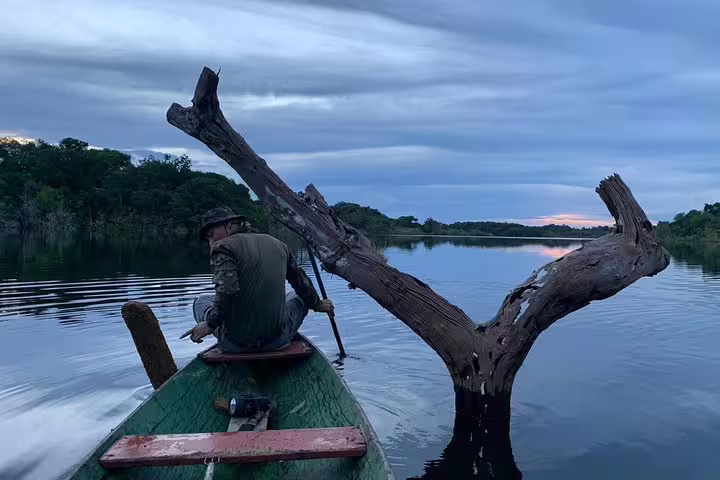 A lone traveler paddling through serene Amazon waters, highlighting the adventure of Amazon Survival Tour 3D/2N.
