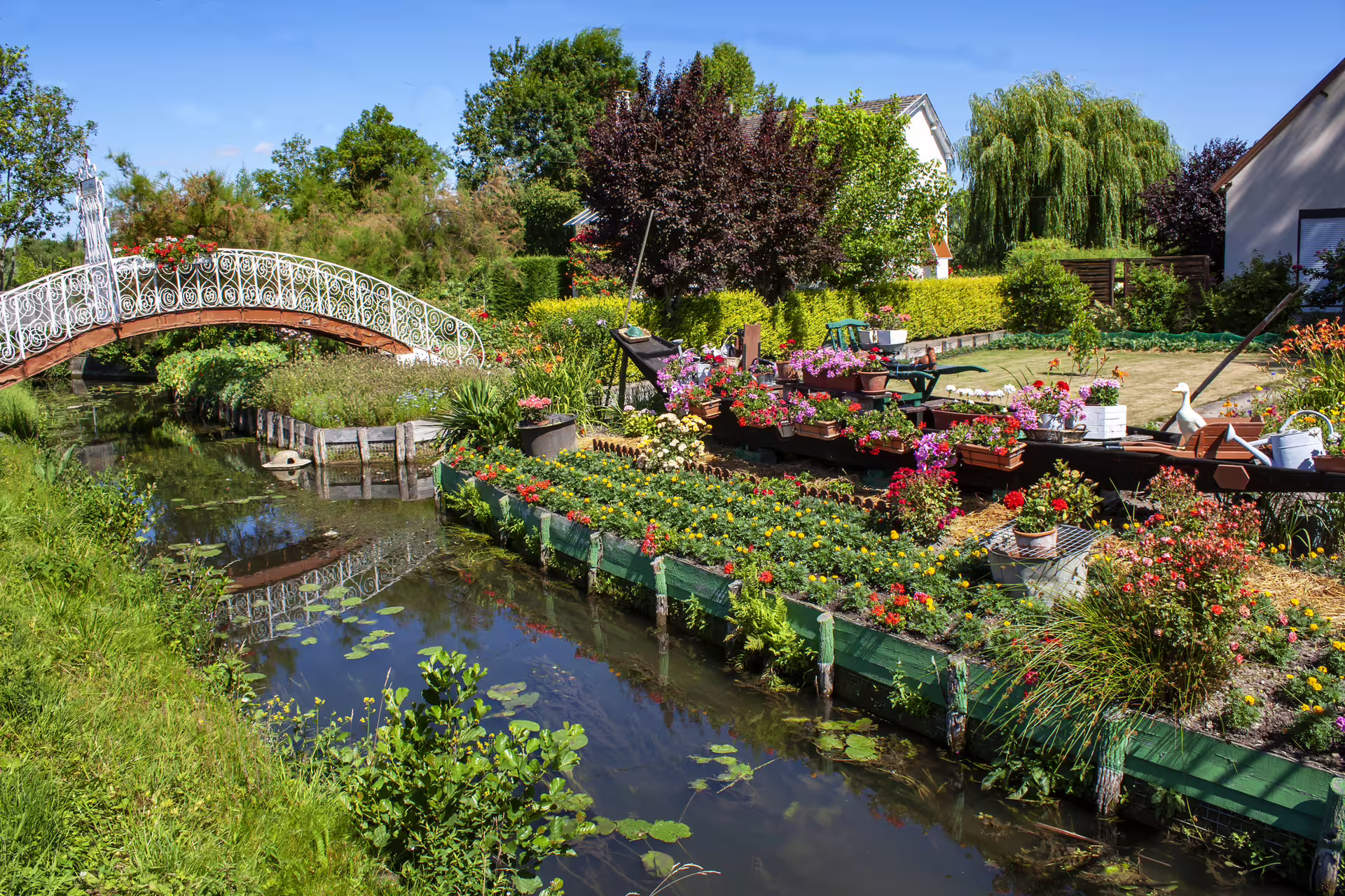 Amiens Hortillonnages floating gardens and arched footbridge, scenic stop on 1-day audioguide walk