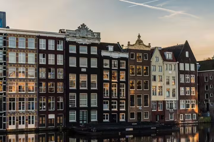 Amsterdam canal houses at sunset, iconic Insta photo stop on the self-guided audio and GPS photo tour