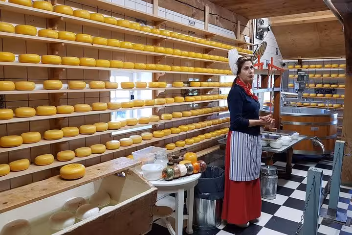 Cheese farm visit near Amsterdam with traditional Dutch cheese wheels and tasting on countryside tour