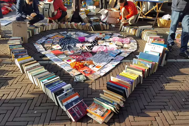 Heart-shaped book display at Amsterdam flea market, a highlight on a private half-day bike market tour