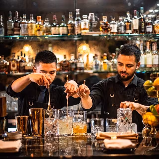 Mixologists crafting signature drinks at Ludwig’s hidden speakeasy bar on Amsterdam VIP cocktail tour