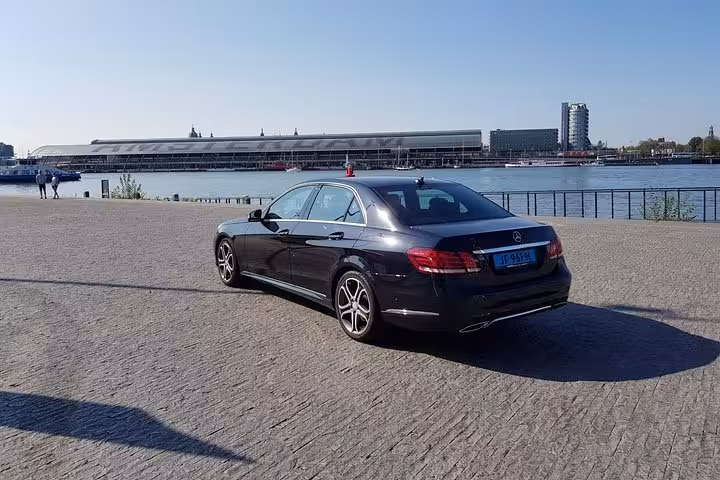 Executive sedan in Amsterdam harbor area, reliable private Amsterdam to Schiphol Airport transfer service