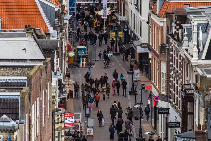 Busy shopping street in Utrecht city center, ideal destination after Amsterdam or Schiphol private transfer