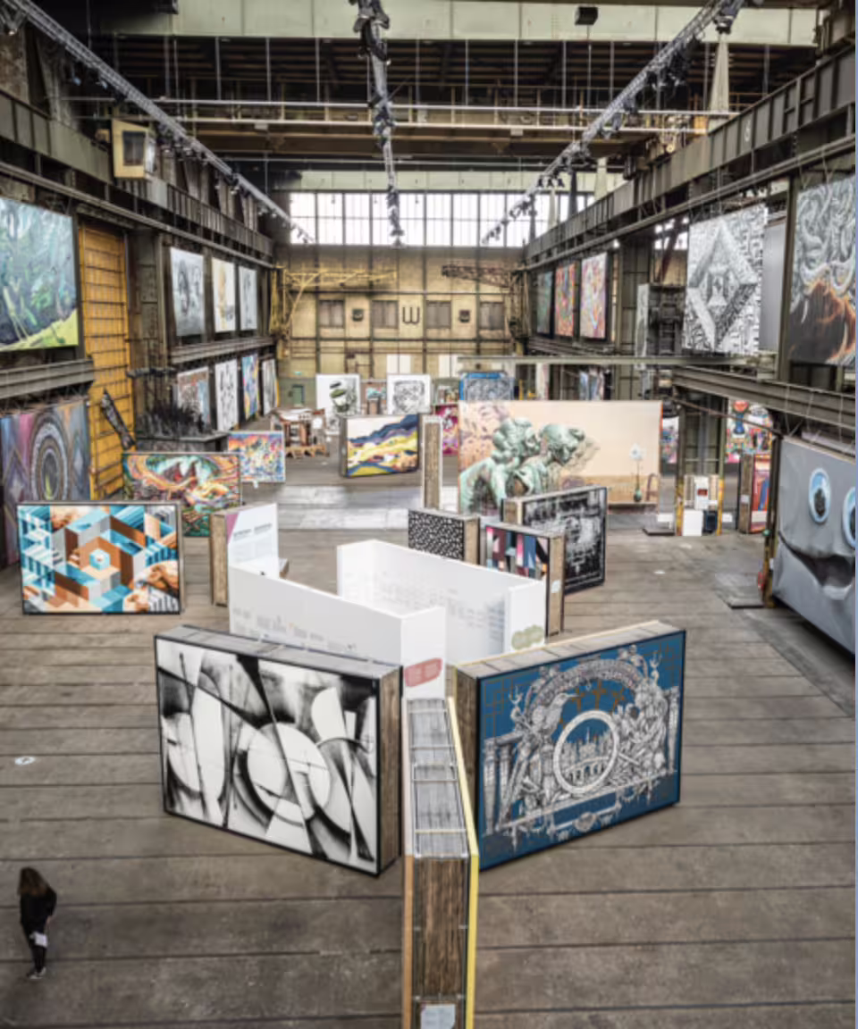 Explore vibrant street art displays in Amsterdam's NDSM warehouse on a private tour, showcasing urban creativity and culture.