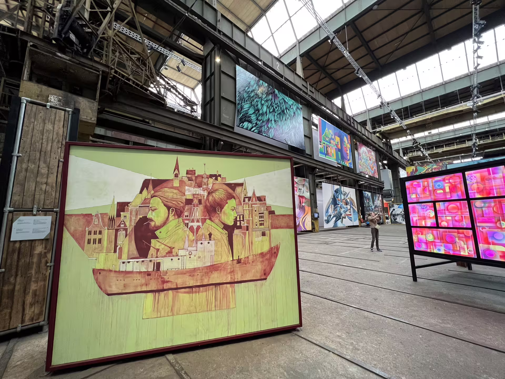 Vibrant street art displayed in Amsterdam's NDSM Wharf, showcasing dynamic urban creativity on a private tour.