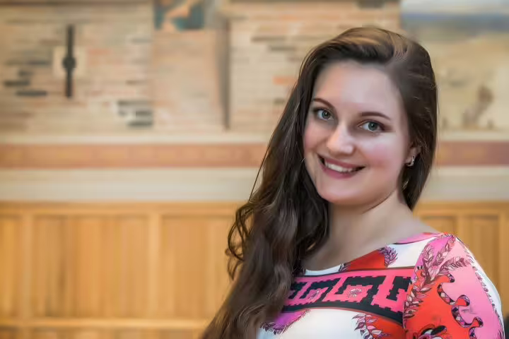 Smiling guide portrait for Amsterdam Van Gogh Museum tour, perfect for small-group visit excluding entry tickets