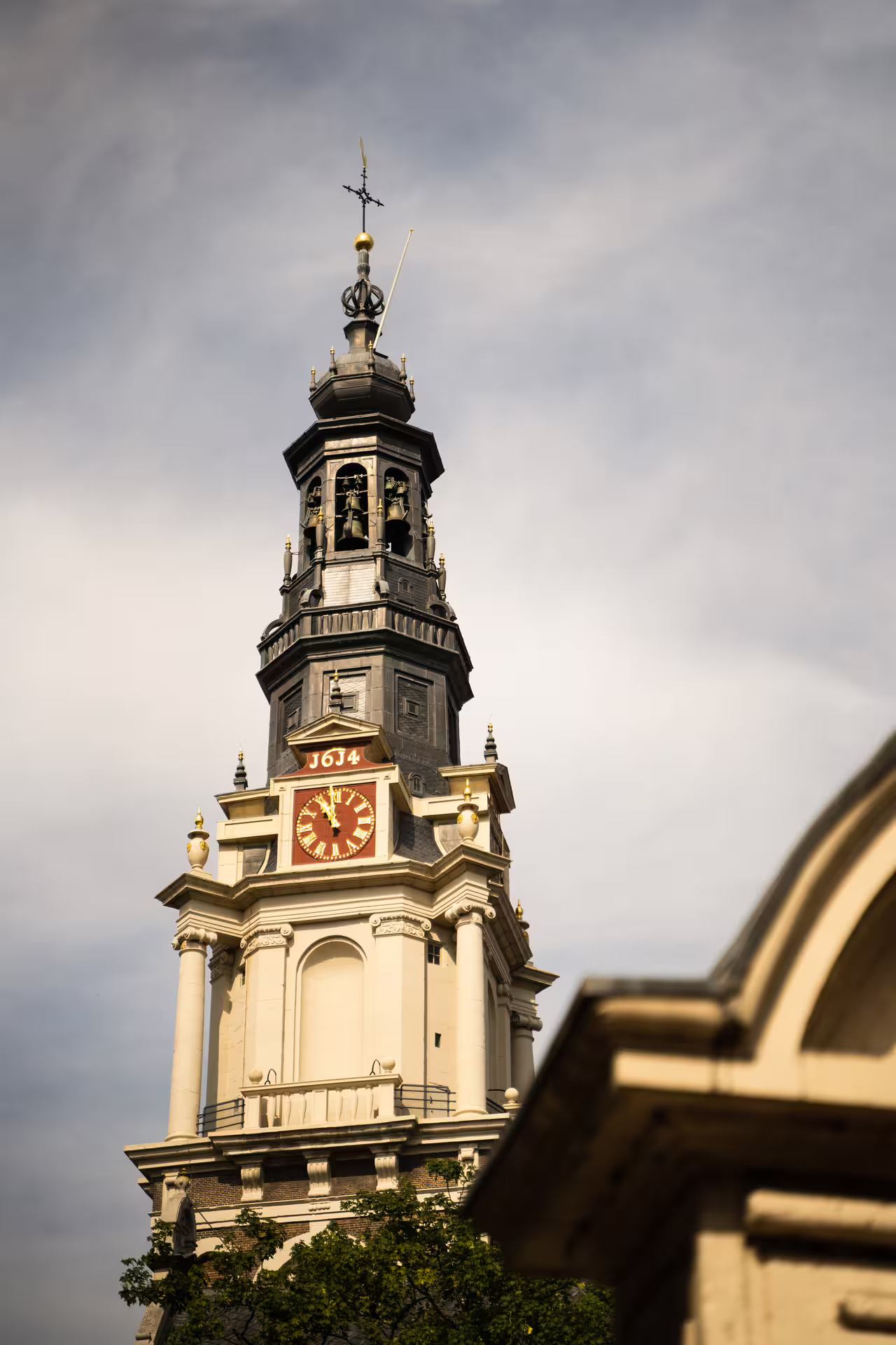 Historic Westerkerk tower against a clear sky, featured in our Amsterdam walking tour with Dutch pancake lunch.