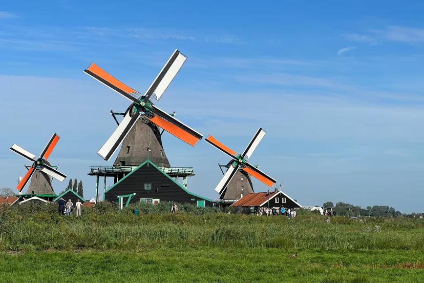Traditional windmills at Zaanse Schans near Amsterdam, scenic stop on Giethoorn day trip with canal cruise