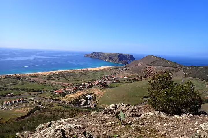 Scenic view of Porto Santo Island coastline from Ana Ferreira, showcasing lush landscapes and crystal-clear ocean ideal for trekking.
